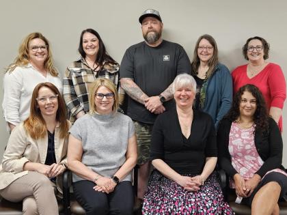 A group photo of our patient and family advisory council (8 people, 1 man, 7 women).